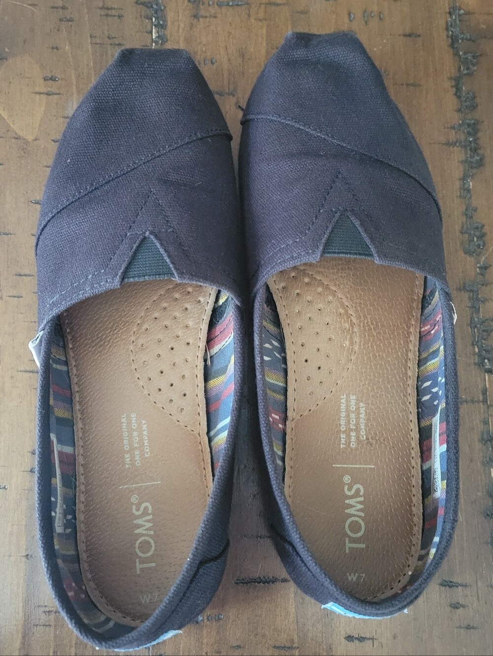 Toms Women's Canvas Slip-On Flats in Black with Multicolor Lining